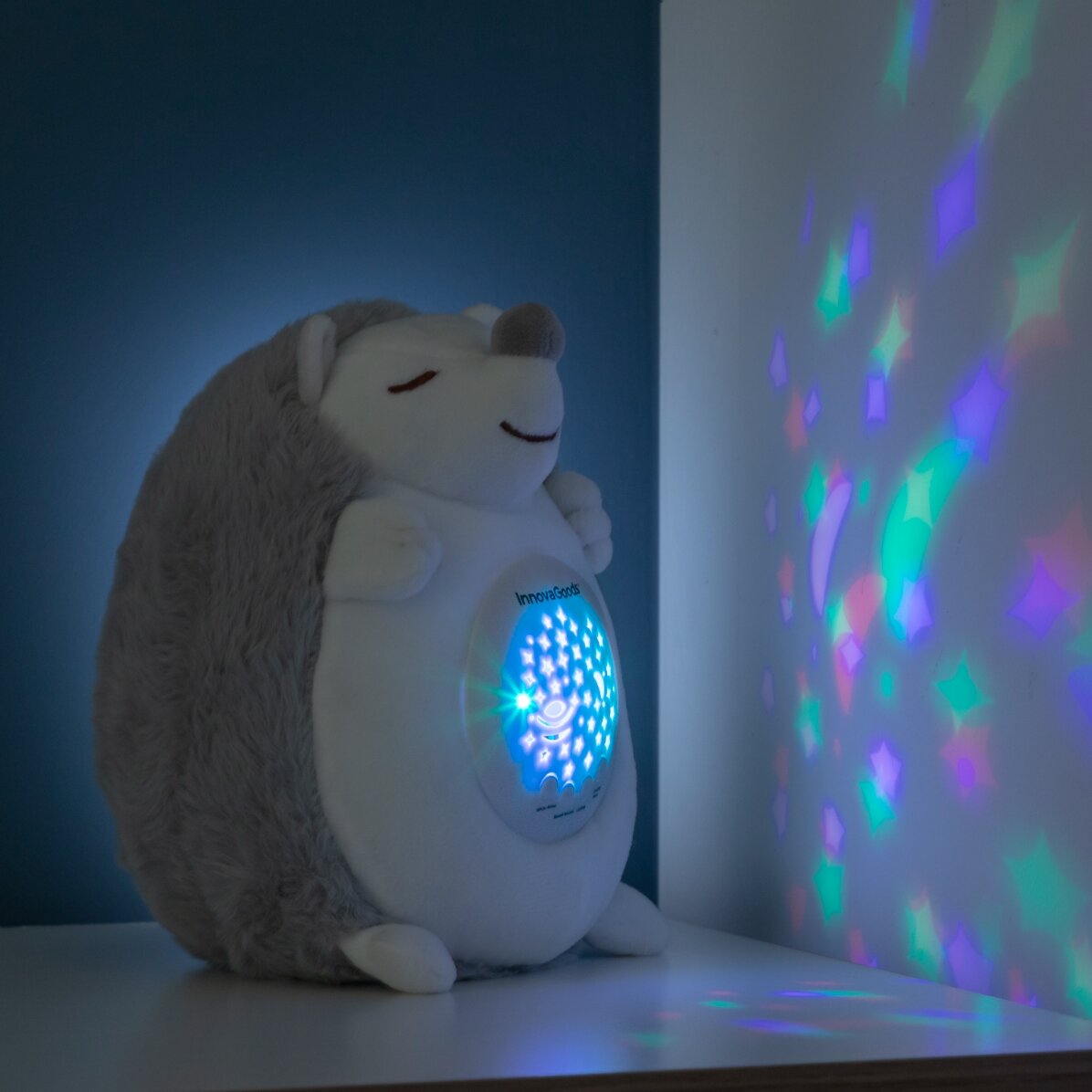 Giocattolo di peluche a forma di riccio con proiettore di luci e suoni